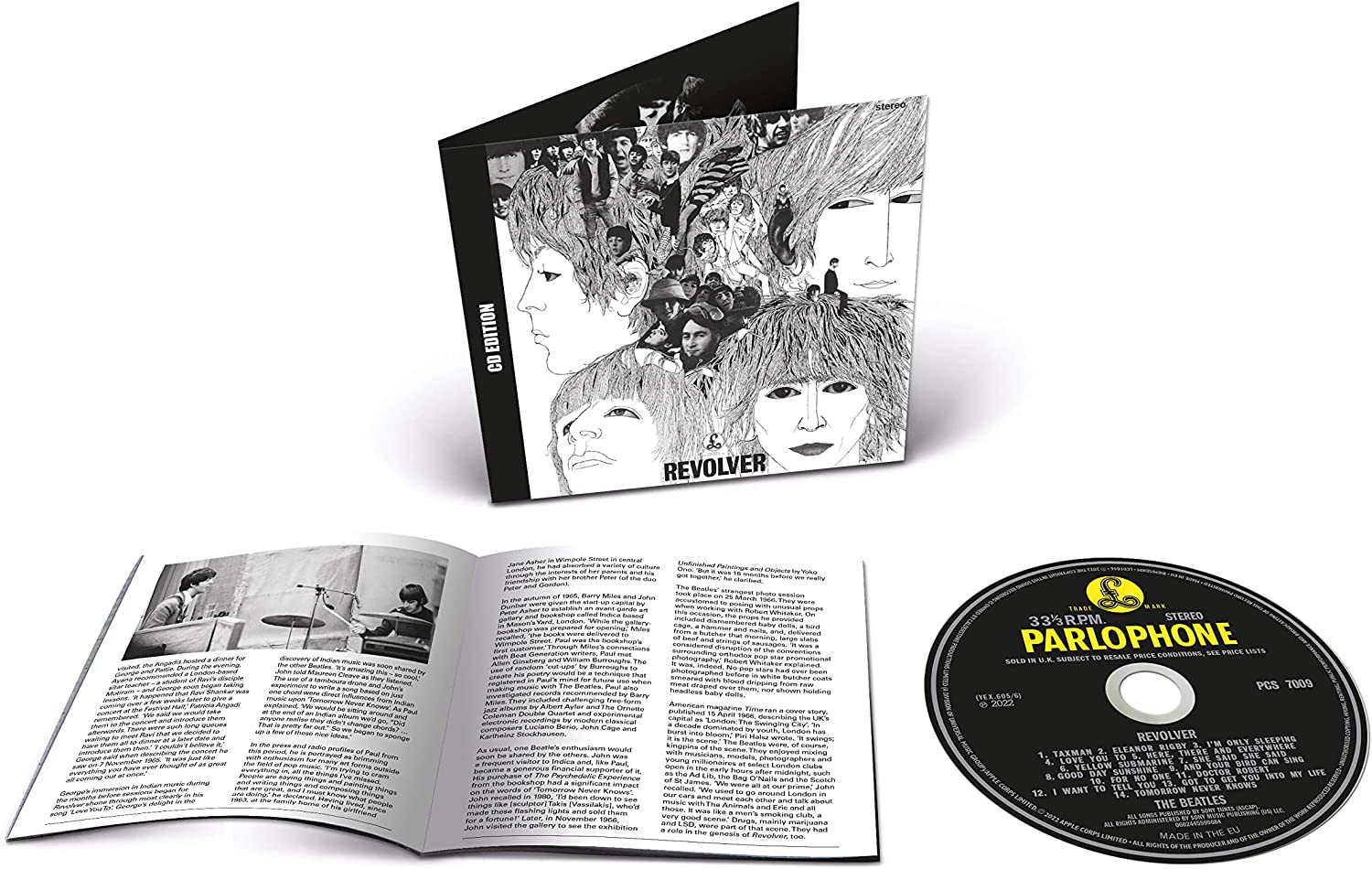 The Beatles Revolver CD album case, open booklet, and disc on a white background.
