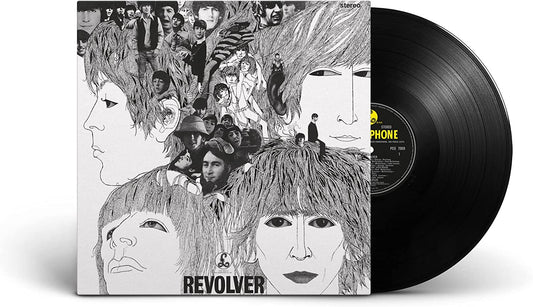 The Beatles’ “Revolver” vinyl record with sketched album cover art.