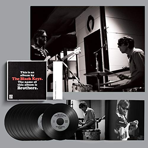 Black album cover with red text reading "The Black Keys.