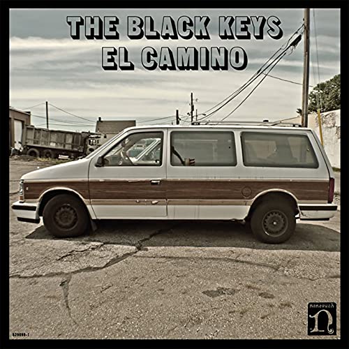 Album cover for The Black Keys’ “El Camino” featuring a wood-paneled van.
