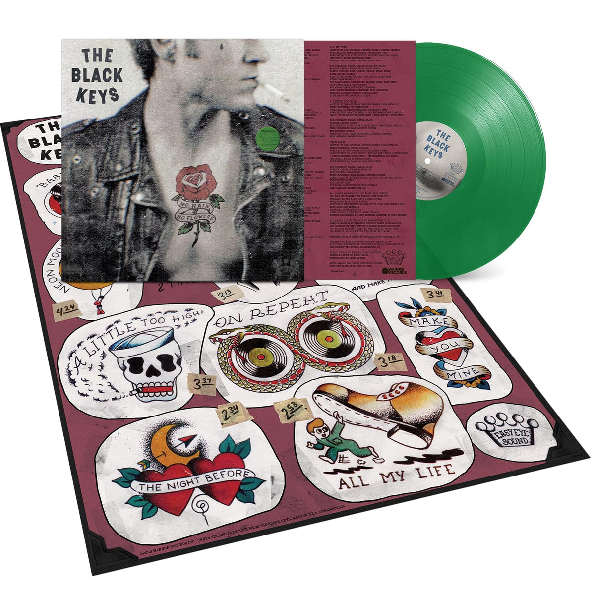 The Black Keys vinyl record with tattoo-style insert and green disc.