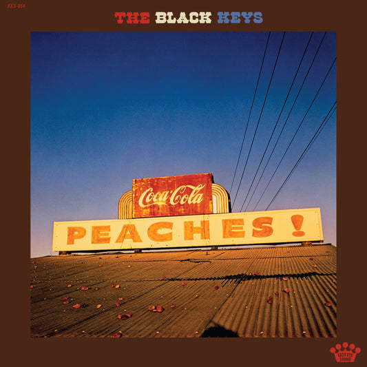 Album cover for The Black Keys’ “Peaches!” featuring a Coca-Cola sign.