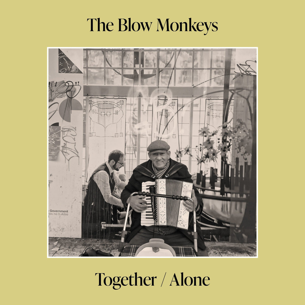 Vinyl album cover for The Blow Monkeys, featuring a man playing accordion.