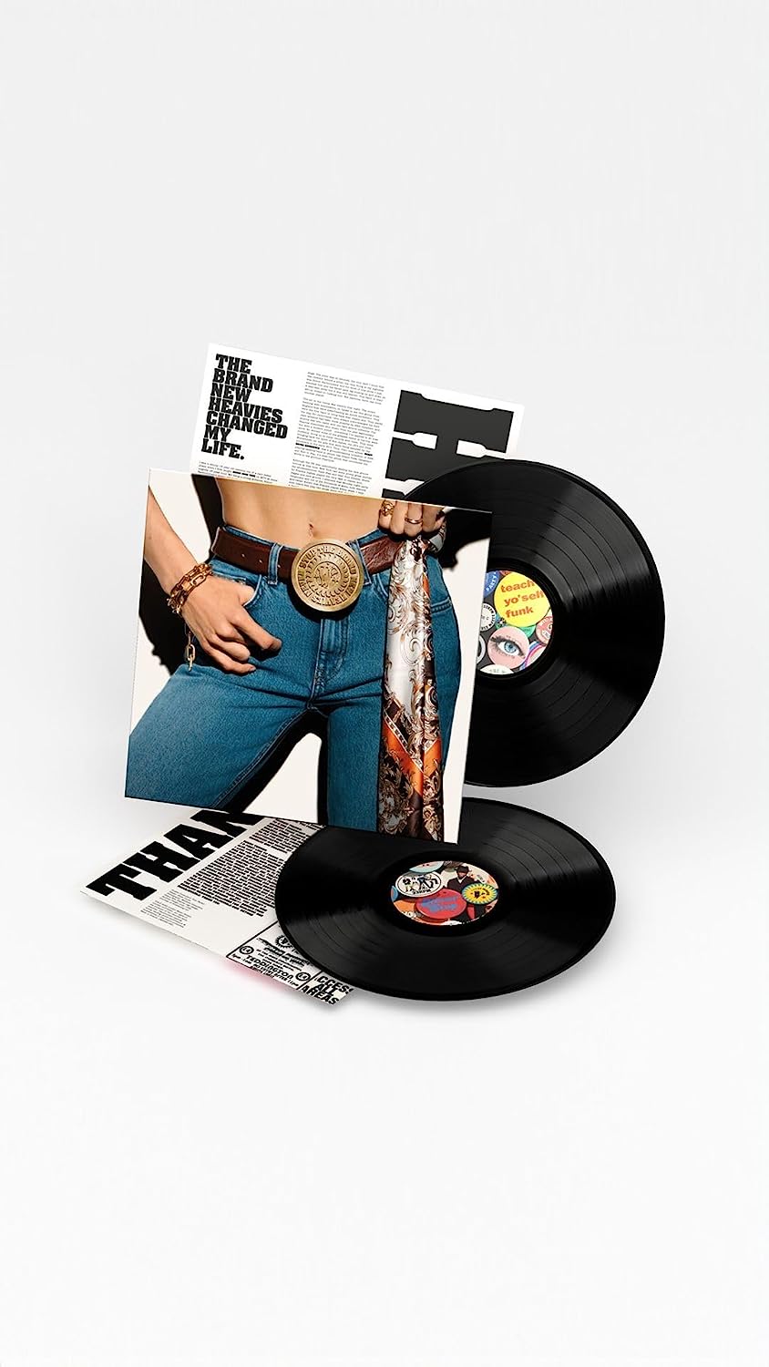 "Double vinyl record album with sleeve featuring a person's torso and jeans."