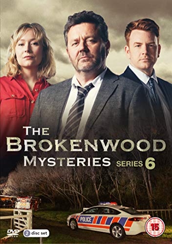 Three actors stand above a police car on The Brokenwood Mysteries Series 6 DVD.