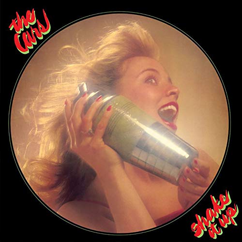 Vinyl record cover with a blonde woman holding a spray can, surrounded by black.
