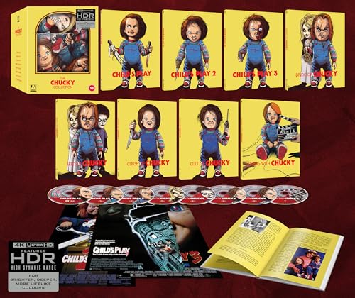 The Chucky Collection box set featuring seven movie cases, discs, posters, and a book.