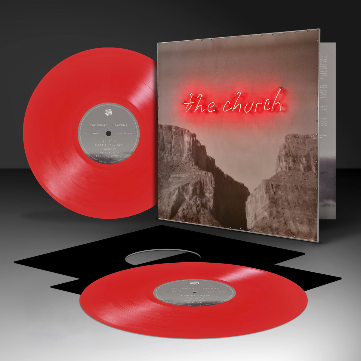 Red vinyl record and CD case for The Church’s “Lacuna” album.