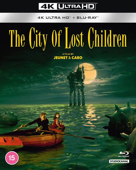 Two children row a boat toward a dark, surreal seaside structure.
