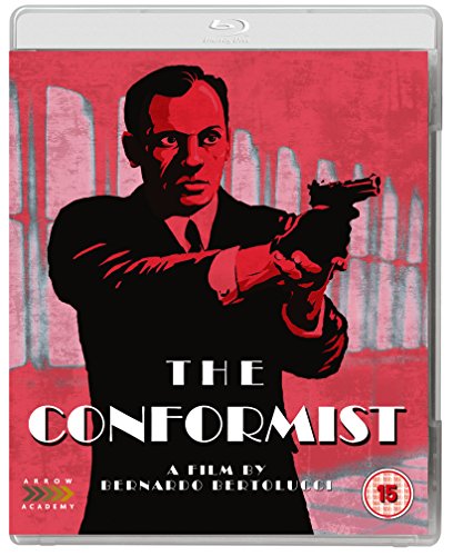 Blu-ray cover for "The Conformist" featuring a man with a gun.