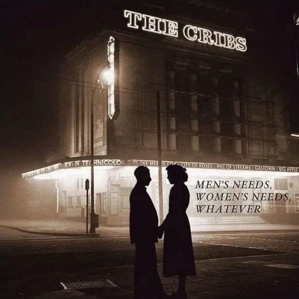The Cribs album cover: a theater facade with a couple silhouetted below.