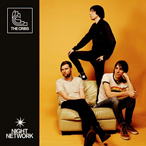The Cribs album cover: three men in casual clothes on a couch.