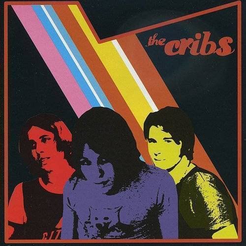 The Cribs album cover with three silhouetted figures and colorful stripes.