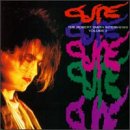 The Cure Japanese Whispers CD cover featuring Robert Smith with colorful repeated text.