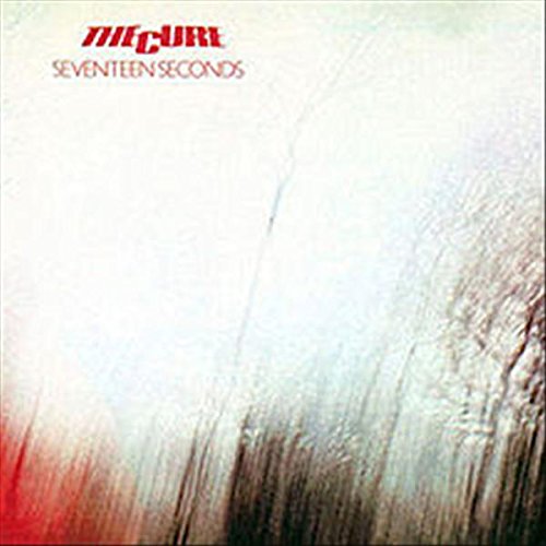 Album cover for The Cure's Seventeen Seconds featuring abstract white, red, and black textures.