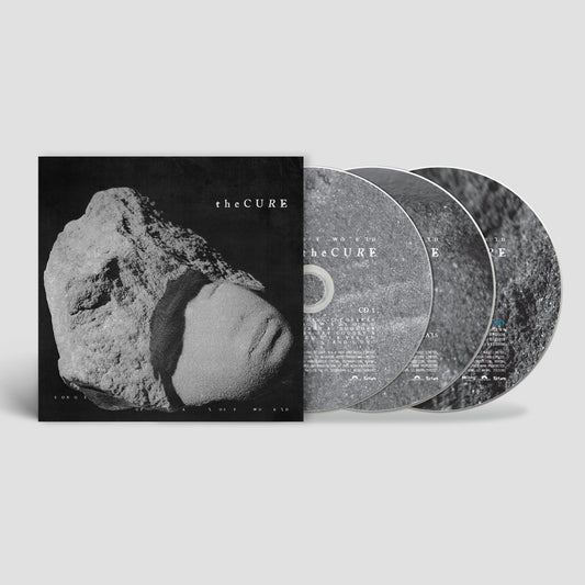 The Cure "Songs Of A Lost World" deluxe CD with stone imagery.