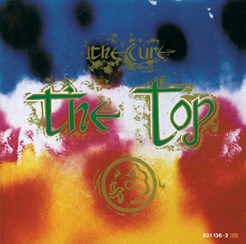Album cover for The Cure's The Top featuring colorful abstract background and stylized text.