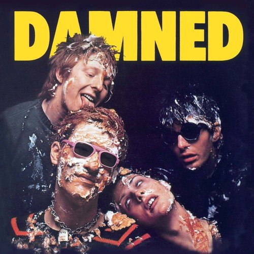 Album cover for The Damned, featuring three band members covered in food.