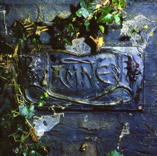 Dark album cover with ornate lettering and surrounding foliage.
