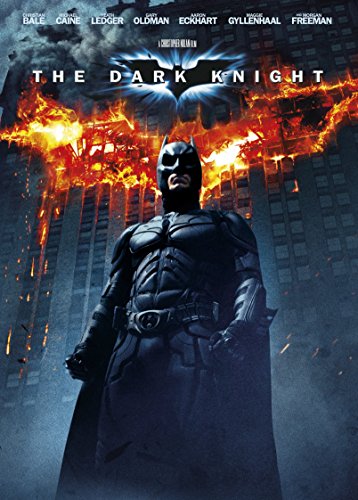 Batman stands in front of a burning cityscape with "The Dark Knight" title above.
