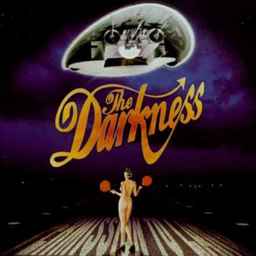 "Album cover with nude woman and UFO, 'The Darkness' in yellow script."