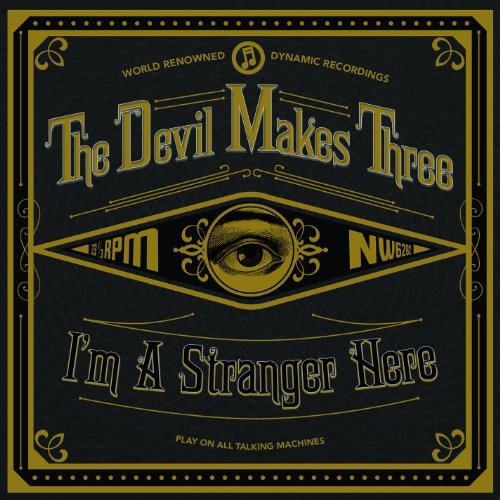 "Black and gold vinyl record cover with 'The Devil Makes Three' and 'I'm A Stranger Here'."