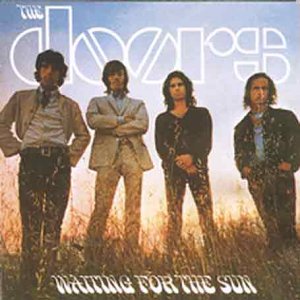The Doors' album cover featuring four band members standing in a field.