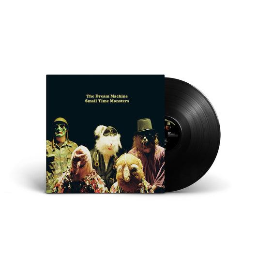 Vinyl record with cover art featuring costumed figures in green hues.