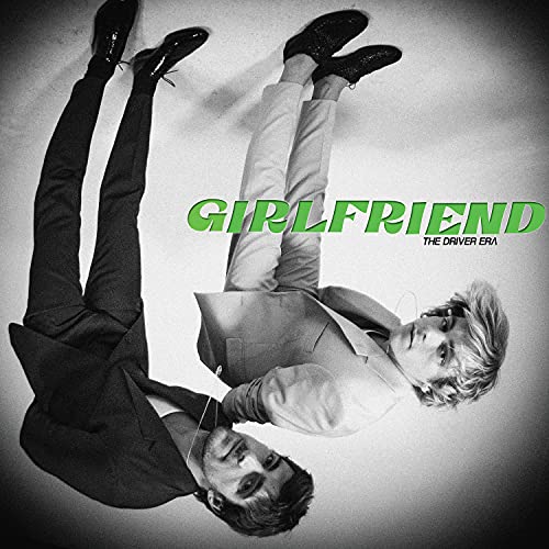 Black and white album cover with a person in a suit and “GIRLFRIEND” text.