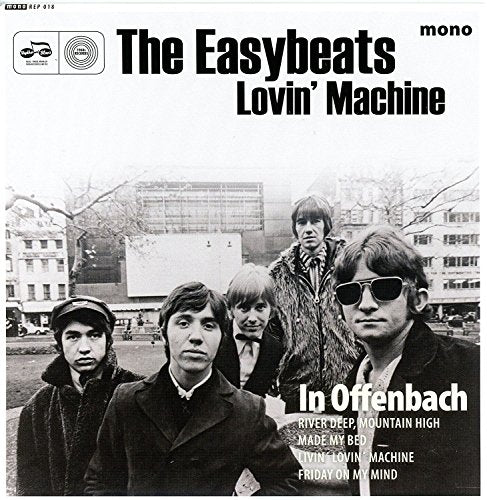 Black and white photo of The Easybeats band members in a city square.