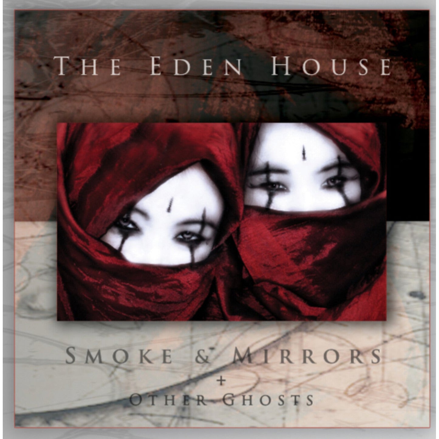 Album cover: two veiled faces with dark eye makeup and text.