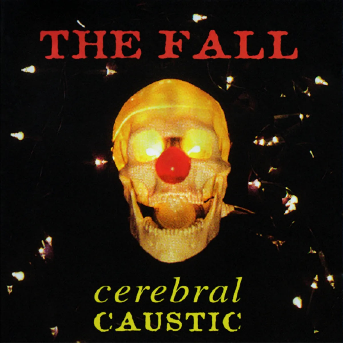Album cover: skull with a red nose against a dark, speckled background.