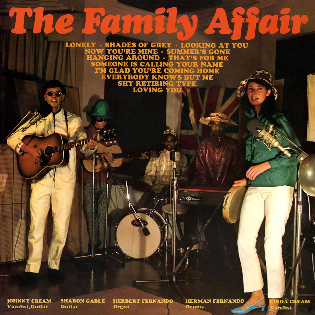 CD cover of The Family Affair, featuring a band in colorful outfits.