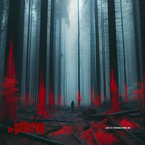 A lone figure stands in a foggy forest with glowing red tree trunks.