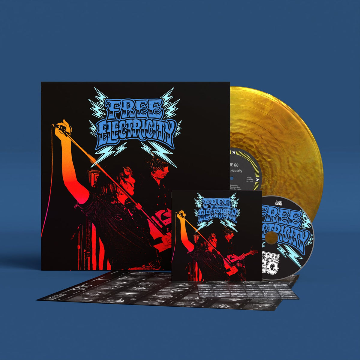 Band performing with instruments, album cover with text "Free Electricity".