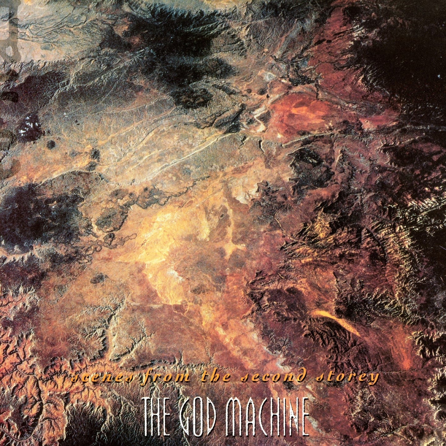Satellite view of arid terrain with album title and band name at the bottom.