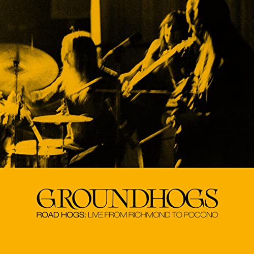 Live band performing, yellow album cover with band name "Groundhogs".
