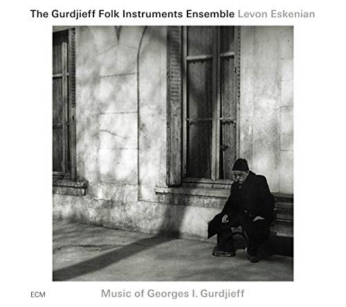 Black and white CD cover with a man sitting by a window.