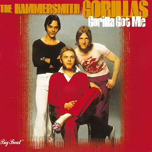 Album cover with three men posing against a red background.