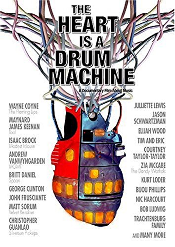 DVD cover for "The Heart Is A Drum Machine" with colorful robotic heart and artist names.