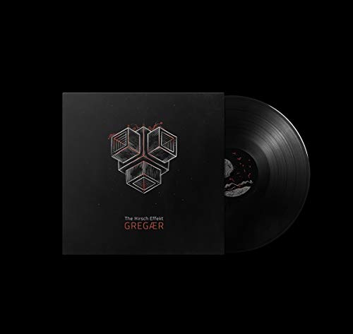 Vinyl record and cover art featuring a geometric cube design on a black background.
