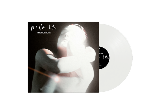 The Horrors Night Life album cover next to a clear vinyl record.