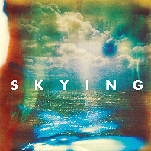 Album cover for The Horrors’ “Skying” with clouds and water imagery.