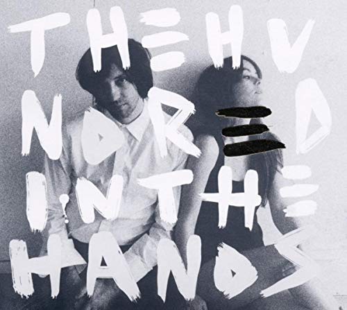 Black and white CD cover with two people and bold text.