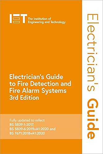 Technical book with fire alarm system diagrams and electrical schematics on a white background.