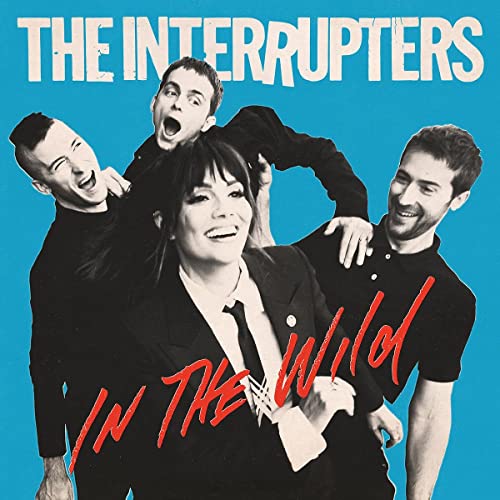 The Interrupters band members posing against a bright blue background on their album cover.