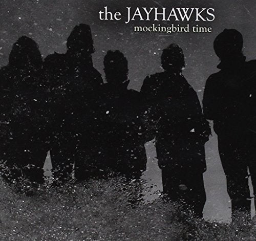 The Jayhawks album cover, silhouetted band members in a rainy scene.