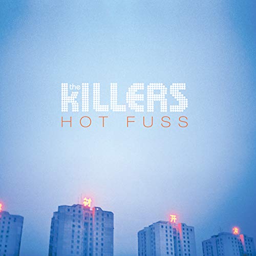 The Killers’ “Hot Fuss” album cover with a city skyline backdrop.