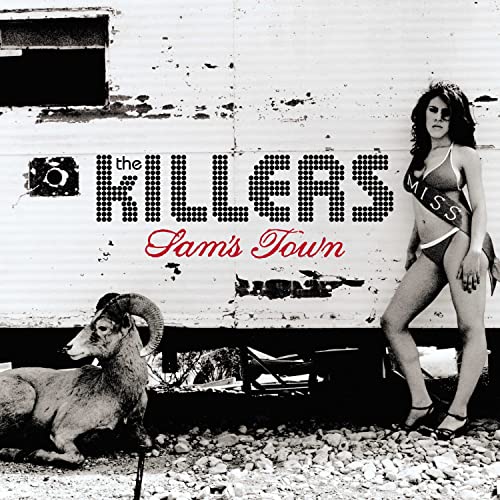 Black and white album cover featuring a woman in a sash, ram, and text.