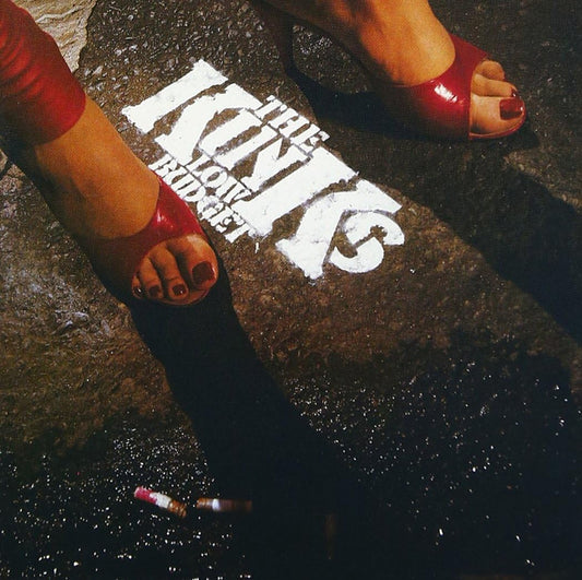Album cover for The Kinks’ “Low Budget” featuring feet and graffiti.